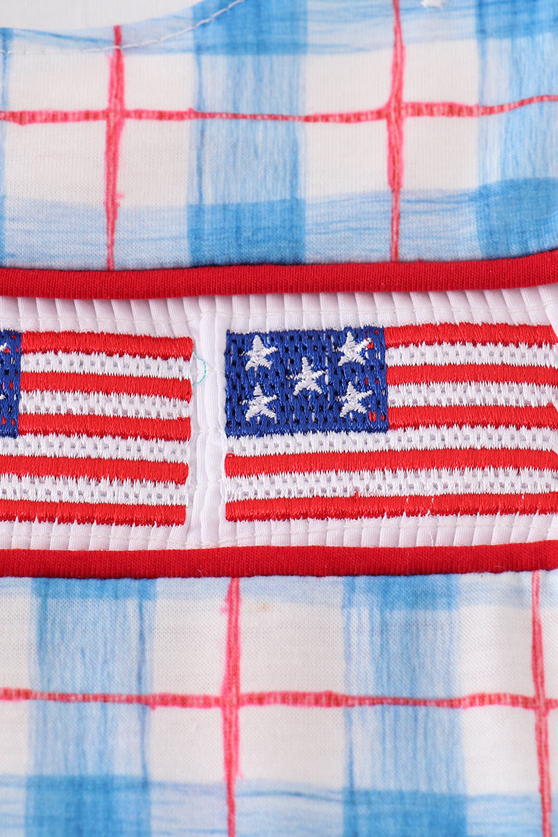 A charming plaid bubble romper with flag embroidery, perfect for festive occasions.