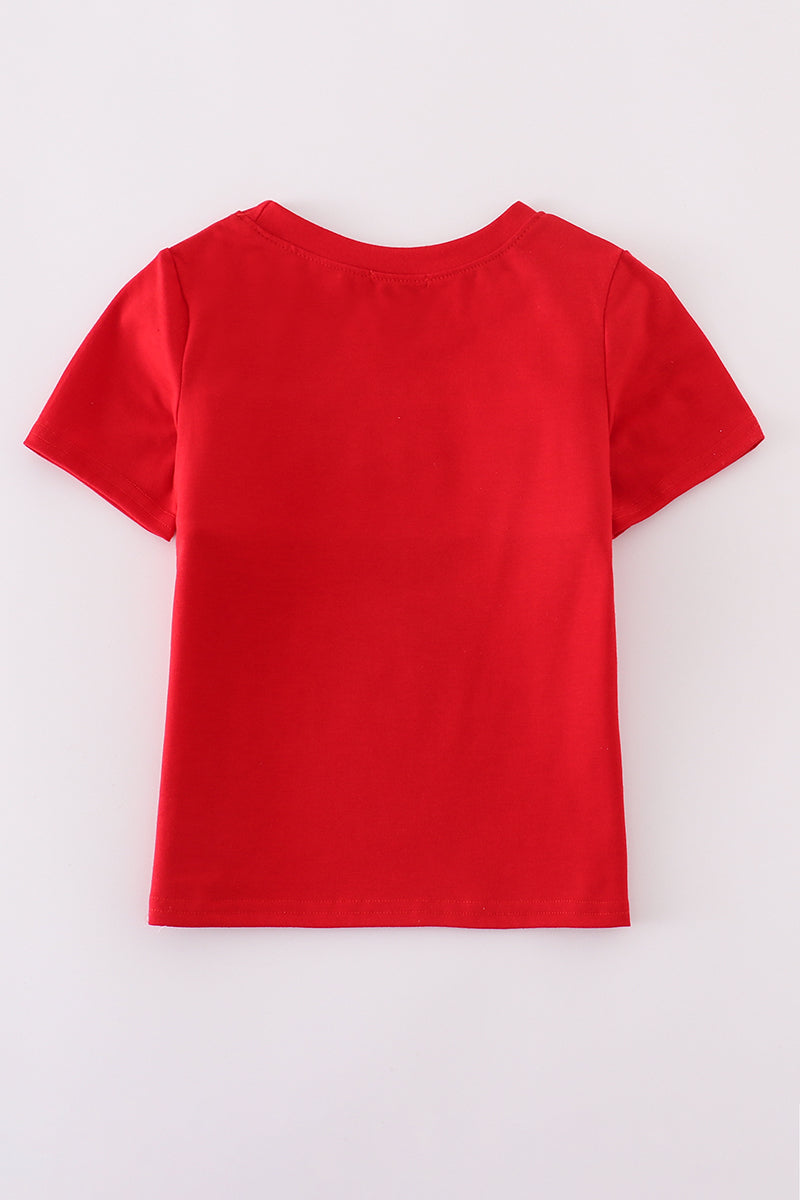 Children's smocked top with colorful flag embroidery, perfect for patriotic celebrations.