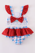 Two-piece swimsuit with flag embroidery, smocked plaid design, and UPF50+ protection.