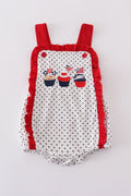 Adorable red ruffle bubble with cake embroidery and playful polka dots.
