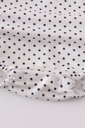 Adorable red ruffle bubble with cake embroidery and playful polka dots.