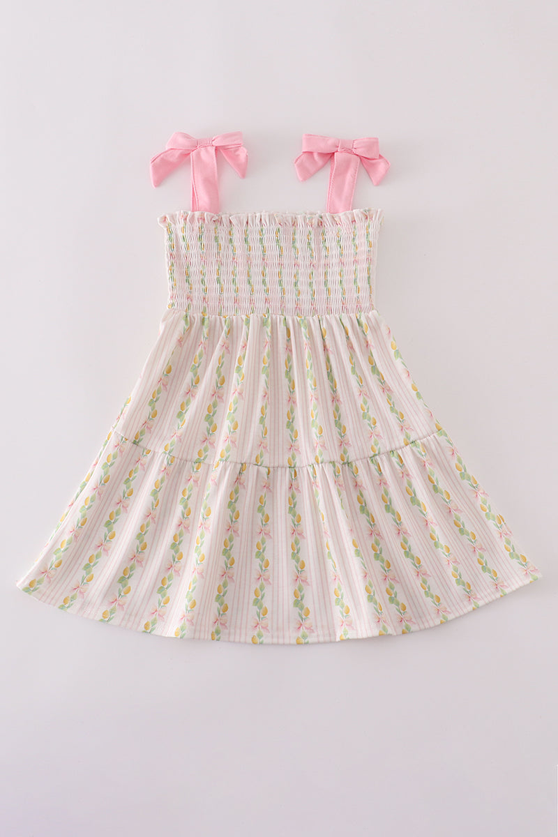 Pink lemon print smocked dress with bow, tiered design, perfect for mom and me.