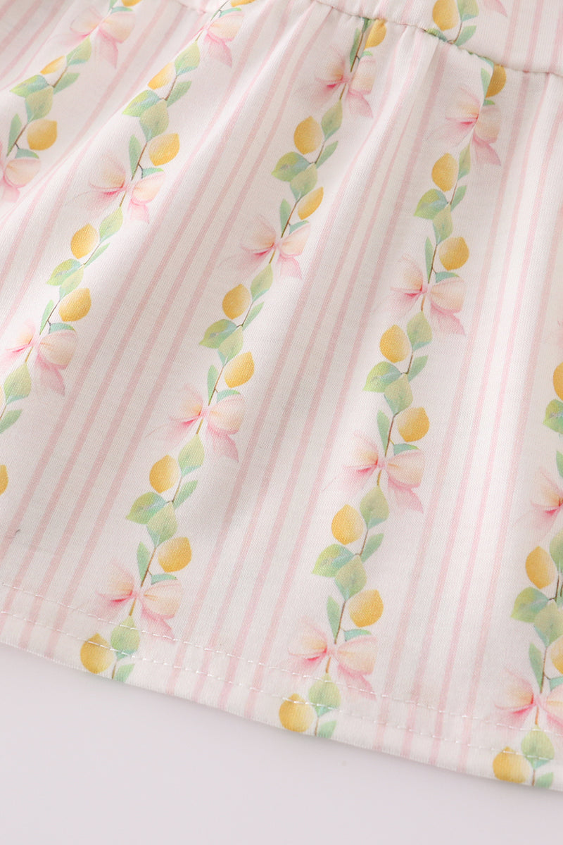 Pink lemon print smocked dress with bow, tiered design, perfect for mom and me.