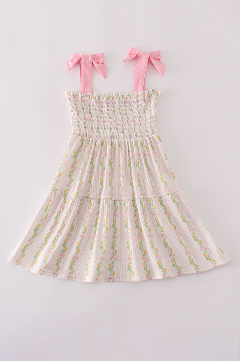 Pink lemon print smocked dress with bow, tiered design, perfect for mom and me.