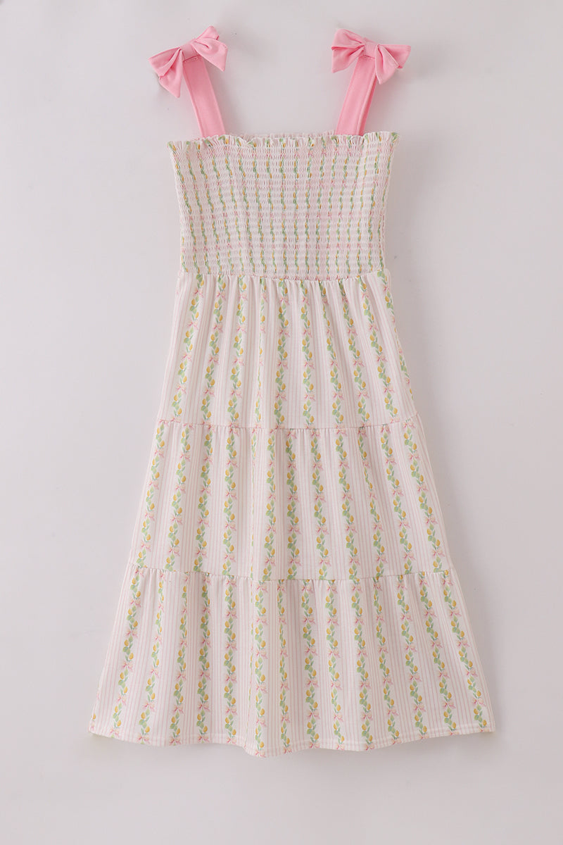 Pink lemon print smocked dress with bow, tiered design, perfect for mom and me.