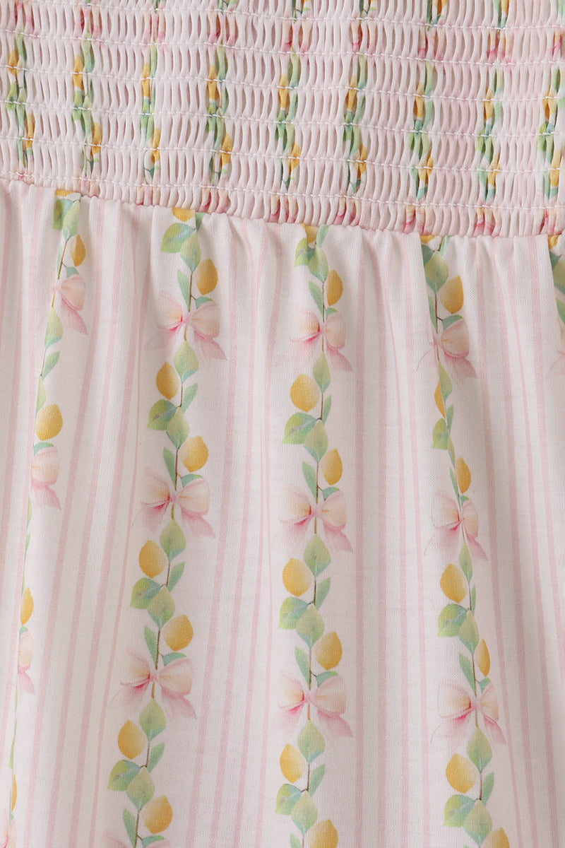 Pink lemon print smocked dress with bow, tiered design, perfect for mom and me.