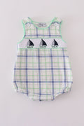 A charming green seersucker bubble with sailboat embroidery, perfect for summer fun.