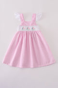 Pink stripe seersucker dress with sailboat embroidery and smocked bodice, perfect for summer.