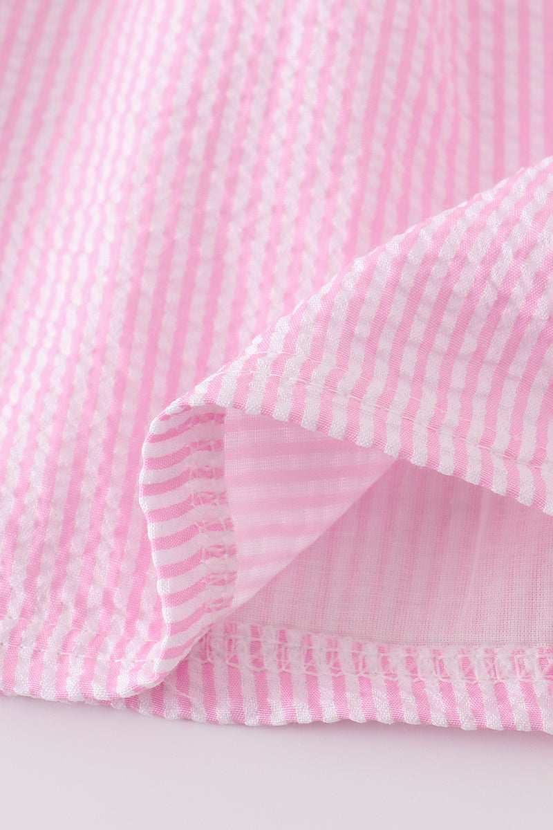 Pink stripe seersucker dress with sailboat embroidery and smocked bodice, perfect for summer.