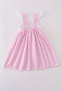Pink stripe seersucker dress with sailboat embroidery and smocked bodice, perfect for summer.