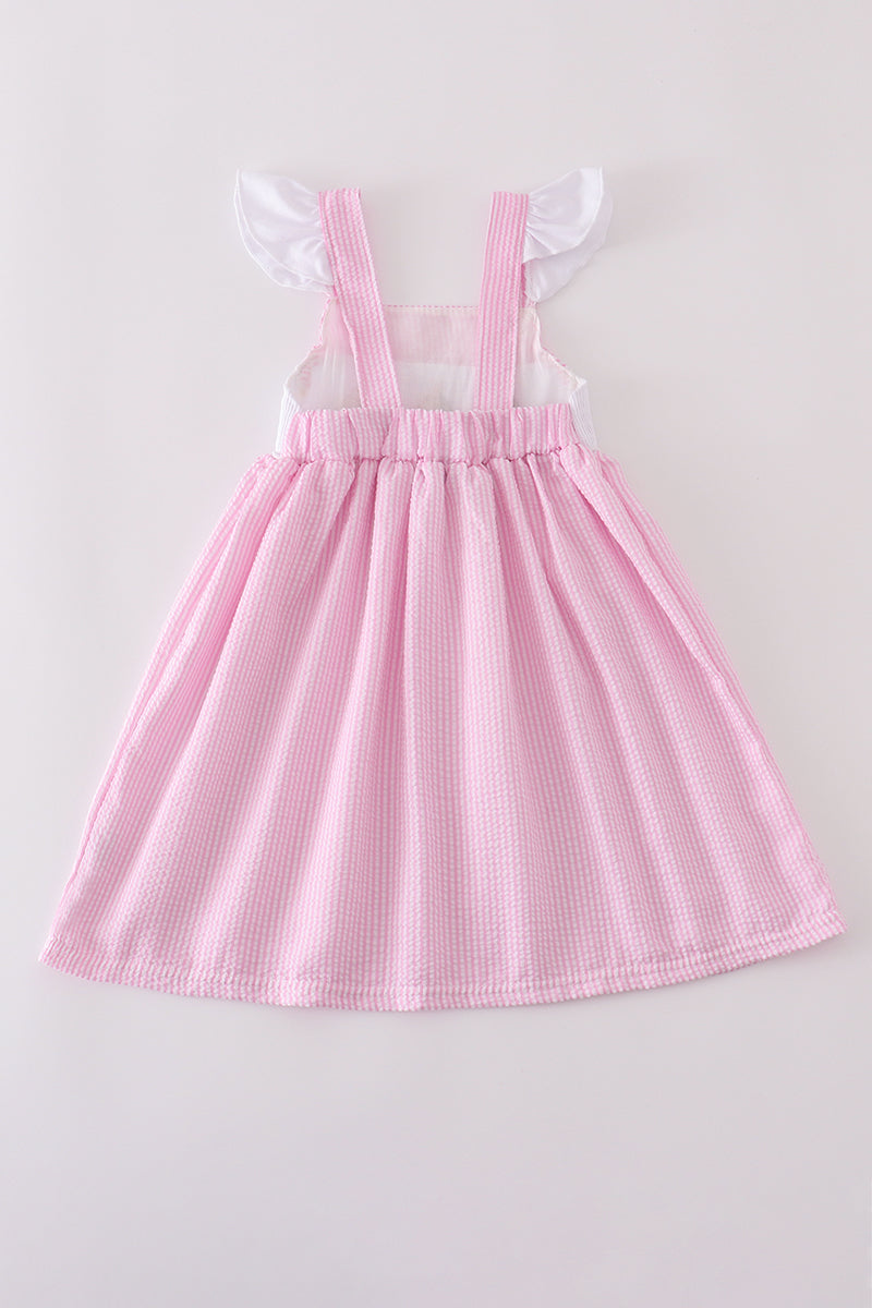 Pink stripe seersucker dress with sailboat embroidery and smocked bodice, perfect for summer.