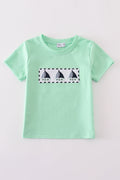 Green seersucker top with playful sailboat embroidery, perfect for summer adventures.