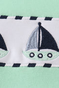 Green seersucker top with playful sailboat embroidery, perfect for summer adventures.
