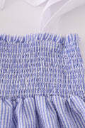 Blue stripe seersucker smocked dress with ruffled sleeves, perfect for family outings.