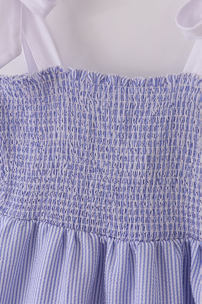 Blue stripe seersucker smocked dress with ruffled sleeves, perfect for family outings.