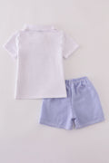Blue stripe seersucker shorts set with playful summer vibes for kids.