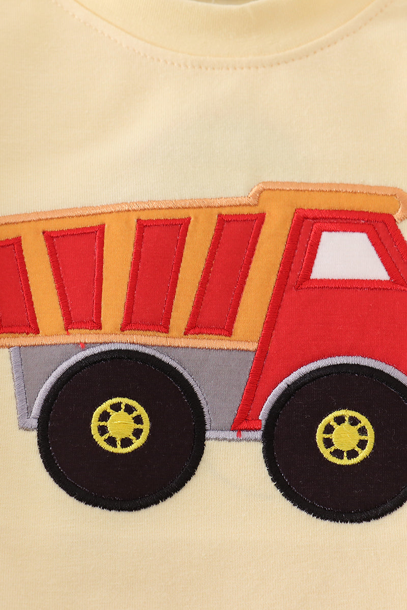 Bright yellow bubble romper with a playful truck applique, perfect for toddlers.