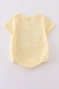 Bright yellow bubble romper with a playful truck applique, perfect for toddlers.