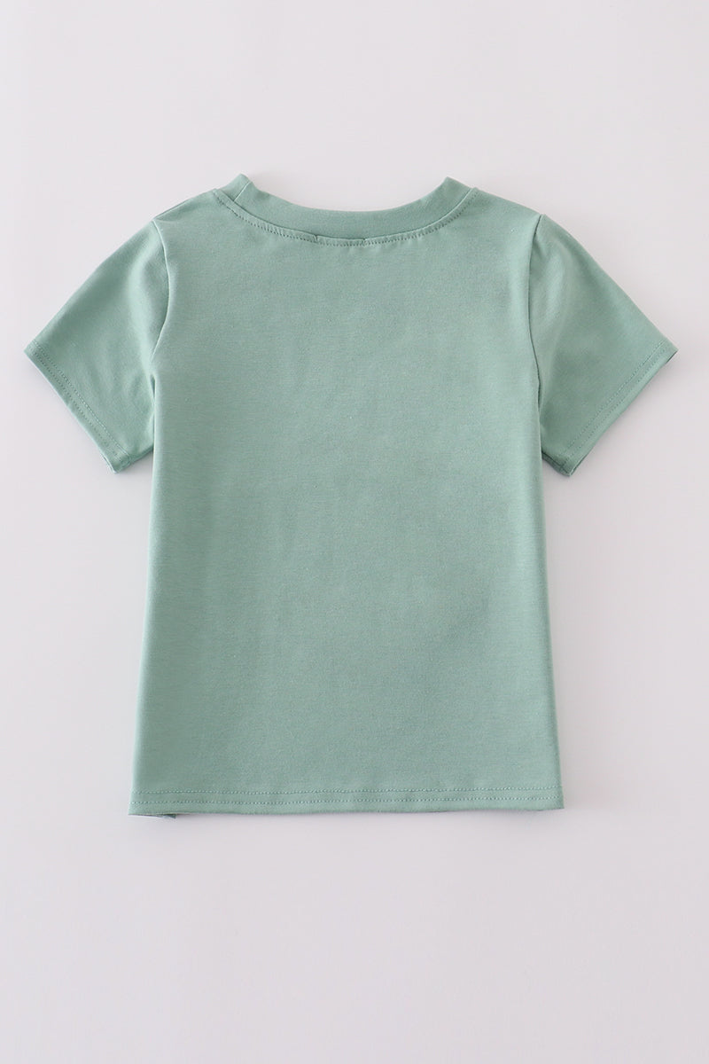 Green top with playful duck applique, perfect for kids' everyday adventures.