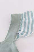 Sage green striped dress with flutter sleeves and ruffle trim, perfect for playdates.