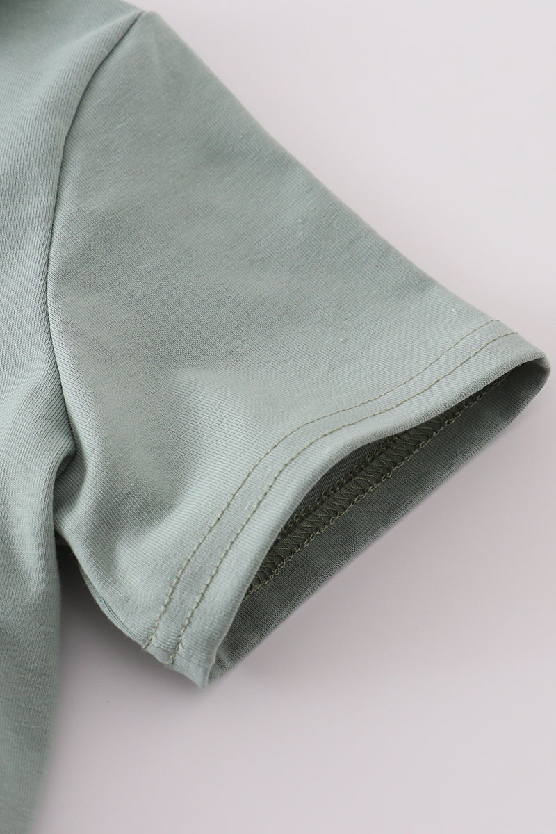 Sage stripe button down shirt with playful green and white pattern.