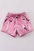Pink laser shorts for kids with a vibrant, colorful geometric pattern.