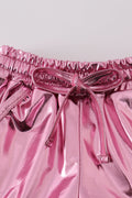 Pink laser shorts for kids with a vibrant, colorful geometric pattern.