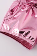 Pink laser shorts for kids with a vibrant, colorful geometric pattern.