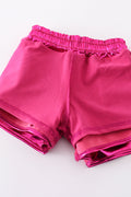 Purple laser shorts with vibrant, swirling patterns, perfect for playful summer adventures.