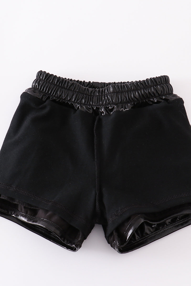 Black laser shorts with a playful, colorful laser beam pattern for kids.