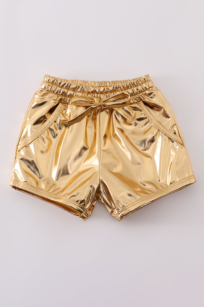 Bright yellow shorts with a playful laser pattern, perfect for sunny adventures.