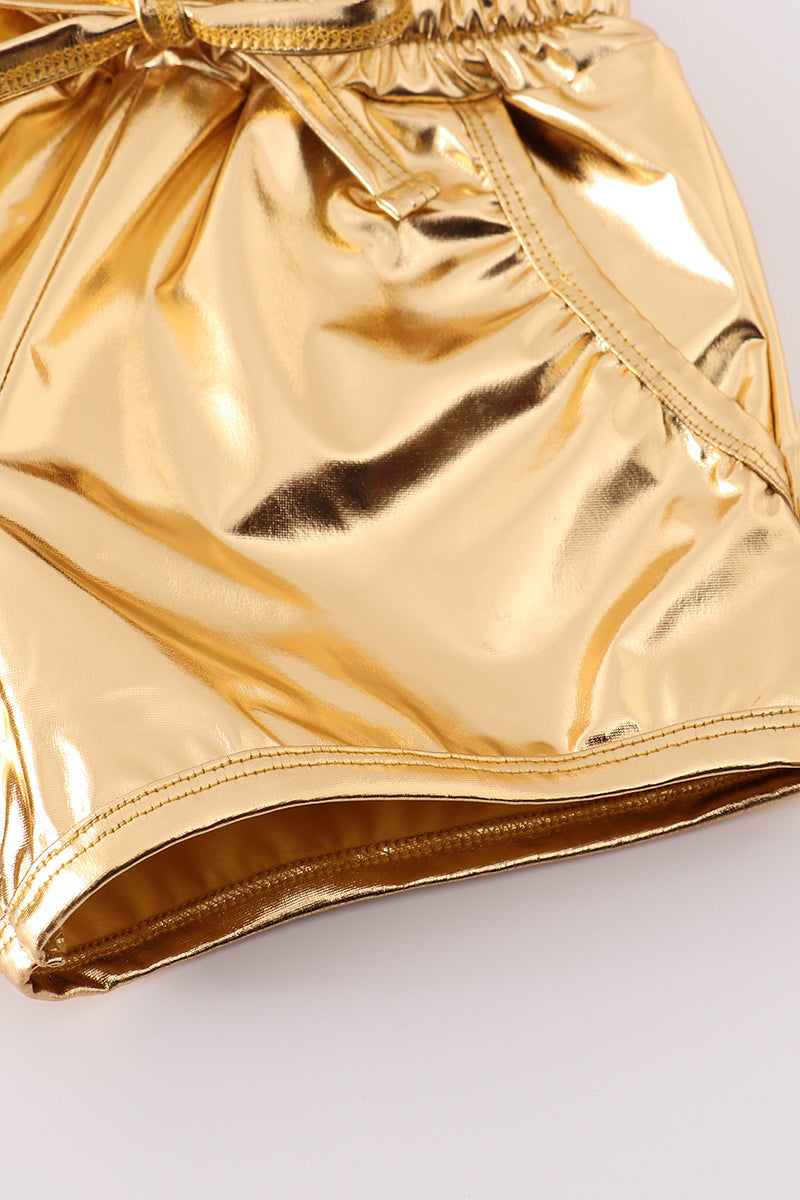 Bright yellow shorts with a playful laser pattern, perfect for sunny adventures.