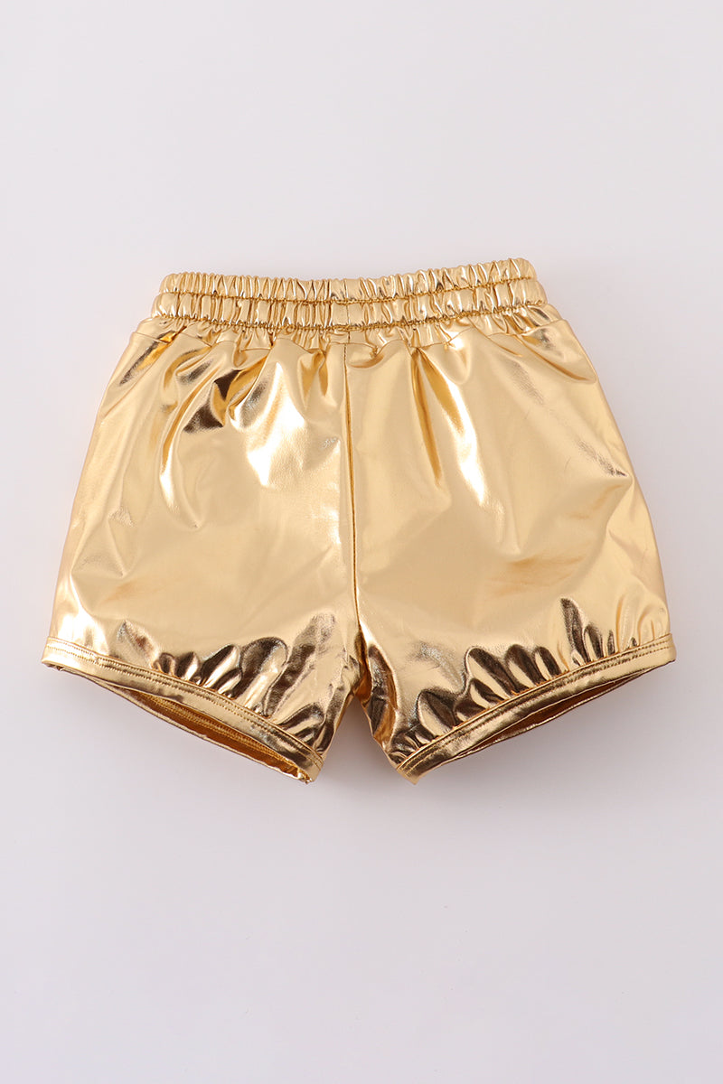 Bright yellow shorts with a playful laser pattern, perfect for sunny adventures.