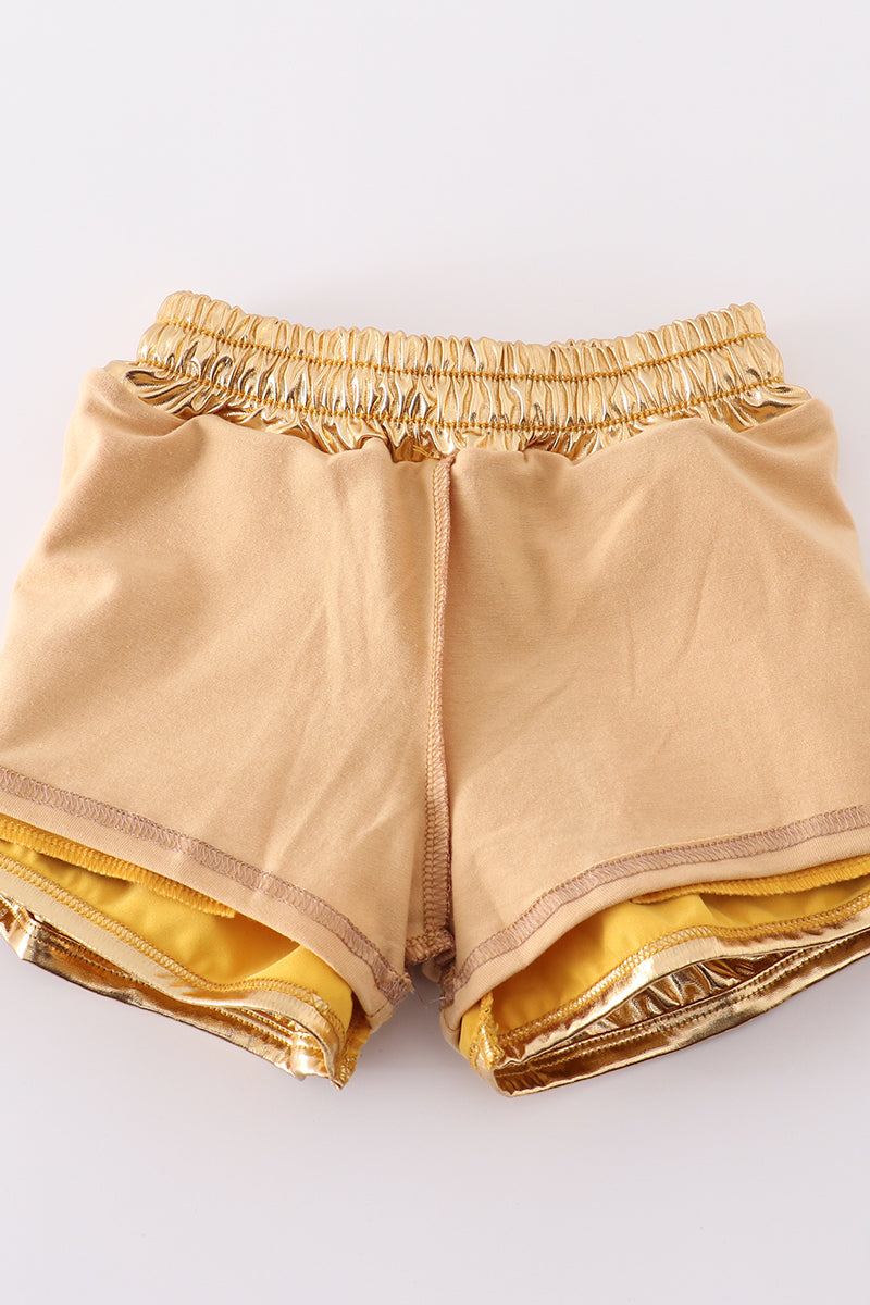 Bright yellow shorts with a playful laser pattern, perfect for sunny adventures.