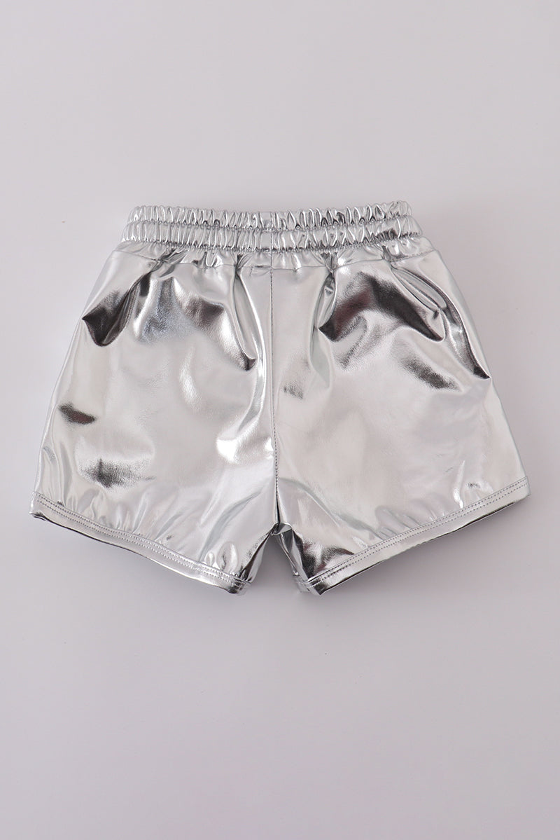 Shiny silver shorts with a fun, futuristic laser pattern, perfect for playtime.