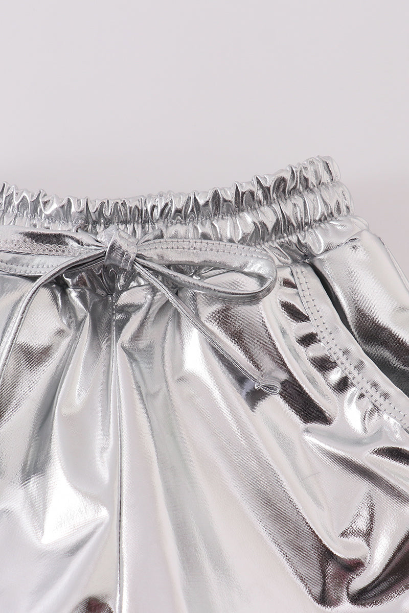 Shiny silver shorts with a fun, futuristic laser pattern, perfect for playtime.