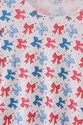 Matching mom and daughter dresses with cute bow appliques on a playful print.