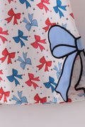 Matching mom and daughter dresses with cute bow appliques on a playful print.