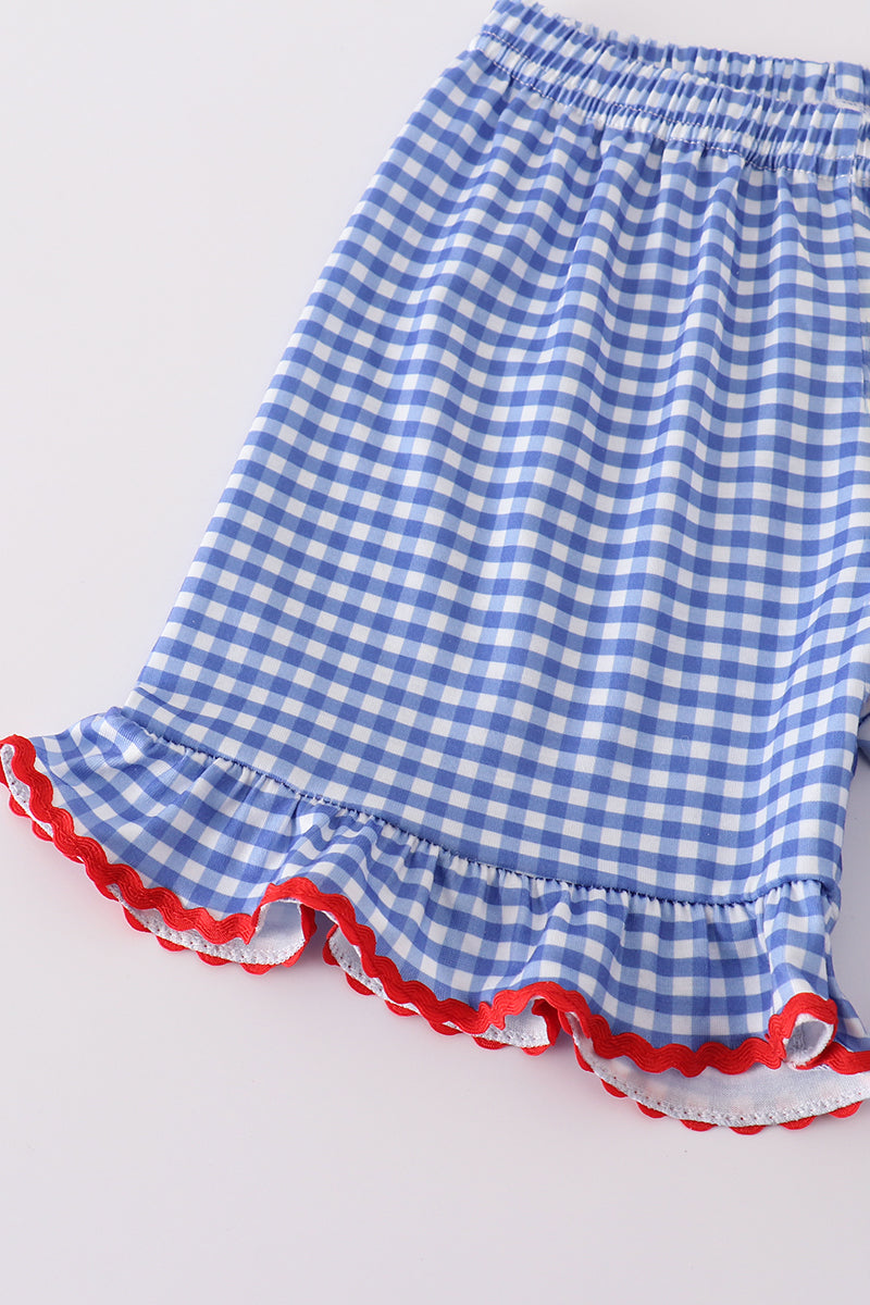 Adorable blue gingham shorts set with a playful flag bow detail.