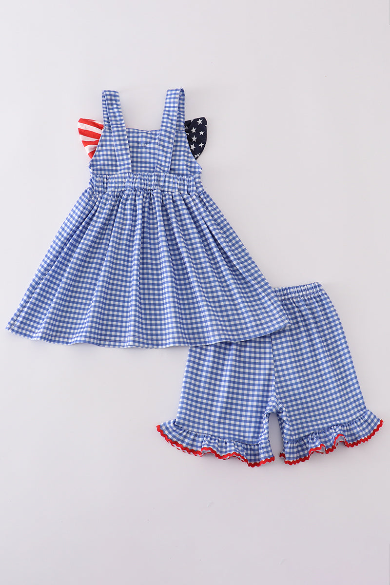 Adorable blue gingham shorts set with a playful flag bow detail.