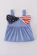 Adorable blue gingham shorts set with a playful flag bow detail.