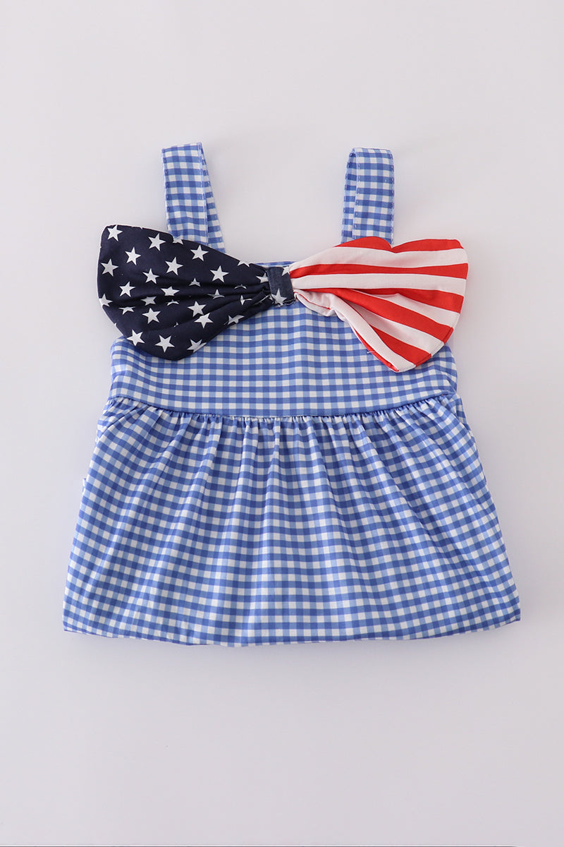 Adorable blue gingham shorts set with a playful flag bow detail.