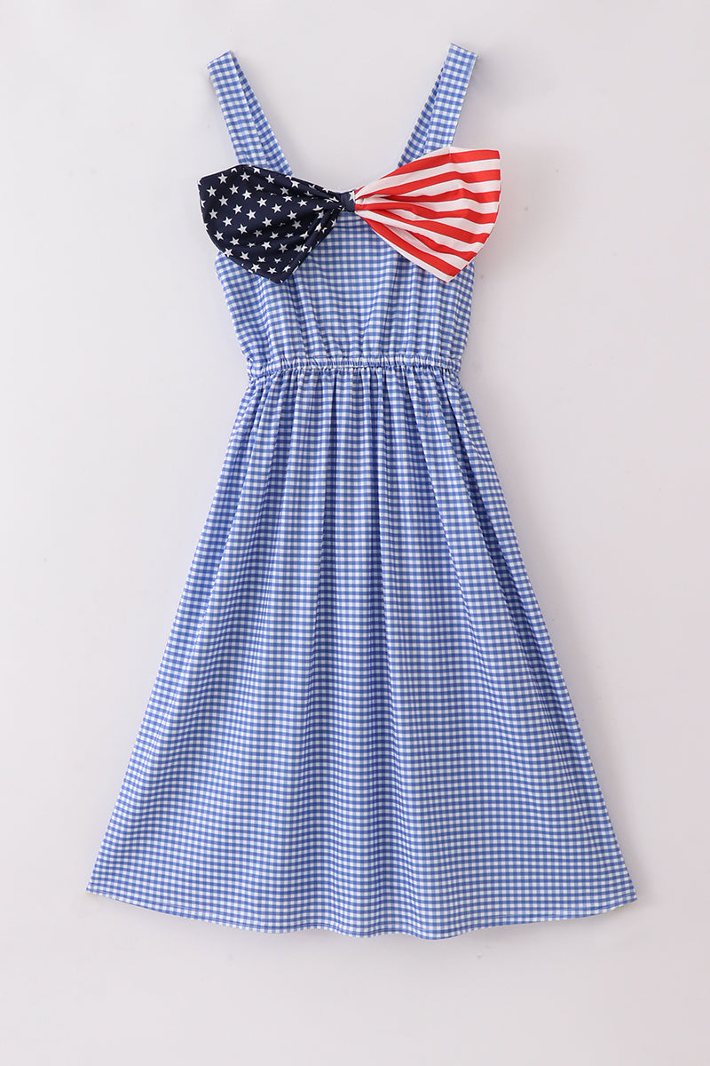 A charming blue gingham mom dress with a playful flag bow accent.