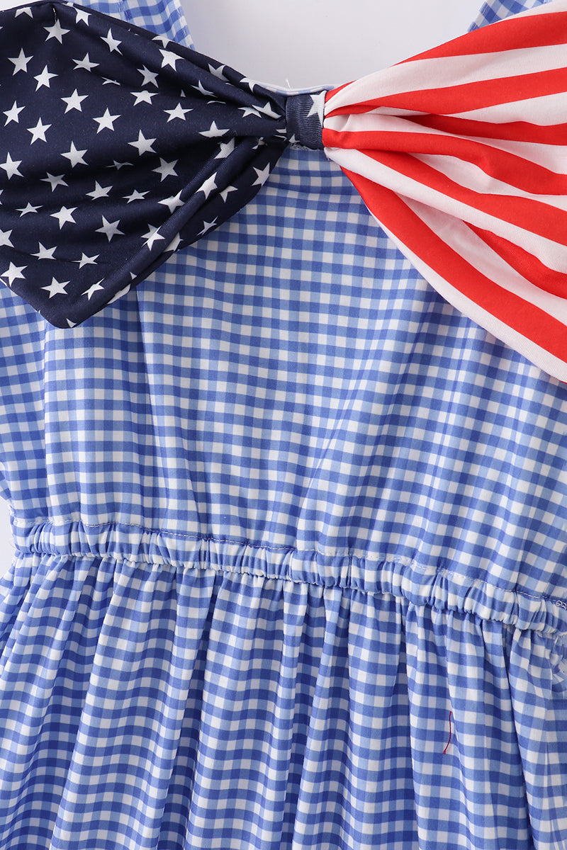 A charming blue gingham mom dress with a playful flag bow accent.