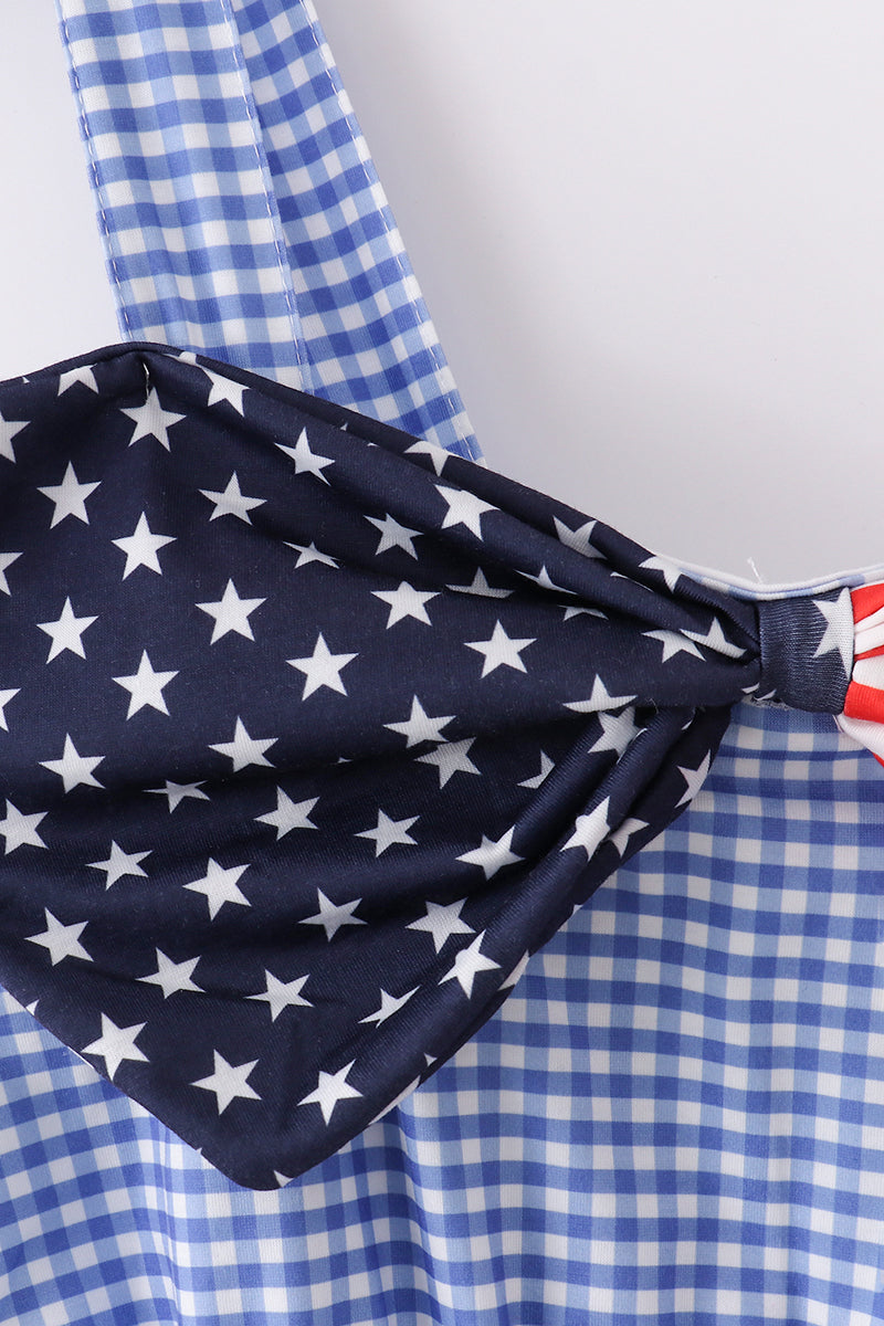 A charming blue gingham mom dress with a playful flag bow accent.