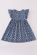 Navy dress with cheerful white daisy print, perfect for playful adventures.
