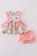 Floral crab embroidery ruffle bloomer set with cheerful summer colors and patterns.