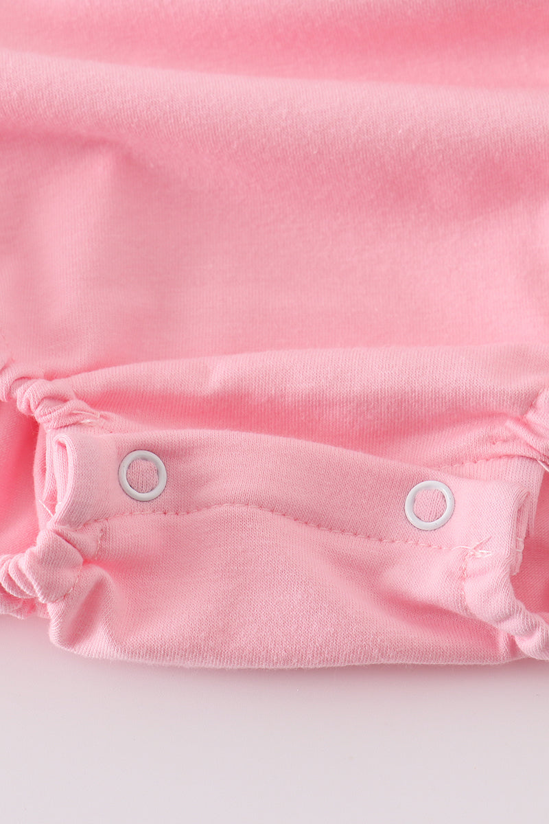 Pink ruffle bubble with castle applique, perfect for playful, fairy-tale adventures.
