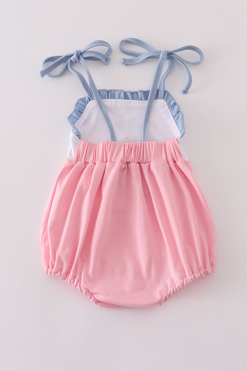 Pink ruffle bubble with castle applique, perfect for playful, fairy-tale adventures.