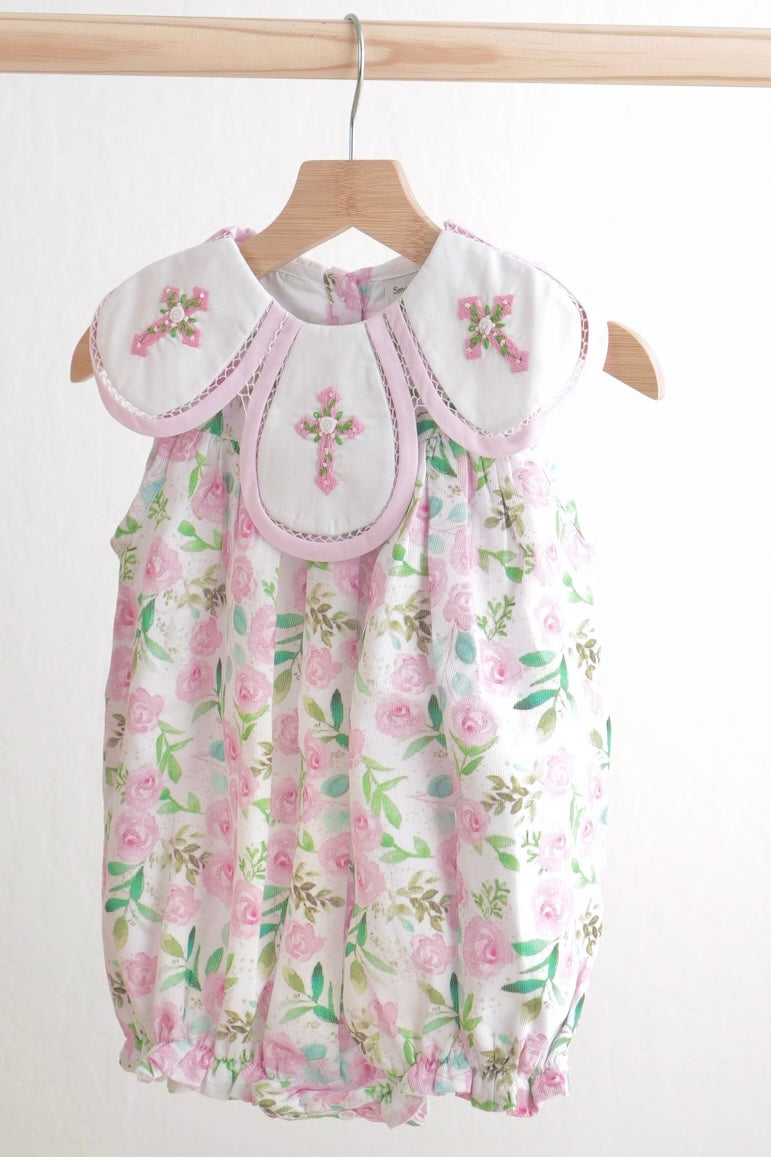 Pink bubble romper with Easter cross embroidery and floral pattern, perfect for girls.